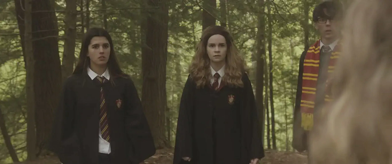 Hermione Granger (Kari Lewis) with Gryffindor students